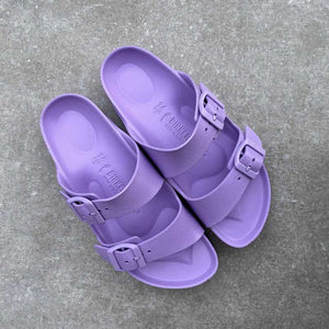 Waterproof Purple sandals with buckles on a gray surface