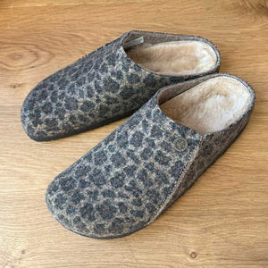 Pair of Brown leopard print Birkenstock slippers on a wooden floor Ireland