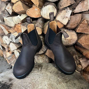 Pair of brown leather boots Outdoors