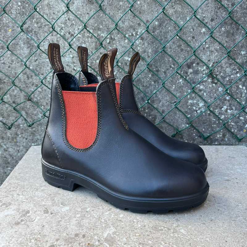 Pair of Brown Leathers Blundstone boots with terracotta inner lining on a concrete surface. Australian work boots sold in Bantry, Ireland 