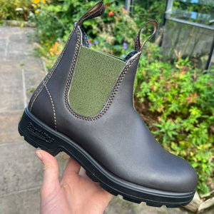 Brown Blundstone Chelsea boot with green side panel outdoor background
